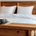 침대 프레임 선택 가이드 - A serene and cozy bedroom featuring a sturdy, warm-toned pine wood bed frame with visible natural gr...